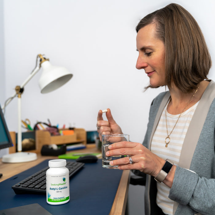 A woman using an Acetyl-L-Carnitine Supplement