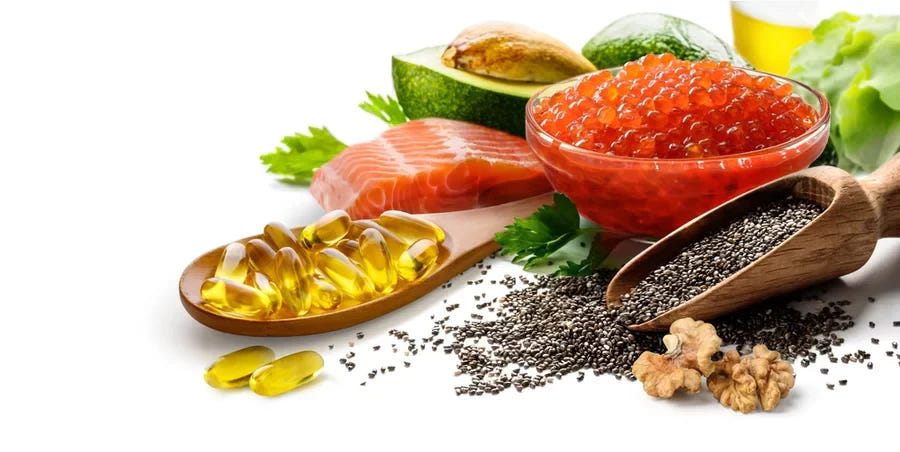 Fish oil caplets next to a salmon filet and various health foods.