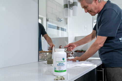 Man uses Optimal Multivitamin to support daily nutrition.