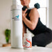 Bottle of Seeking Health product with a person exercising in the background