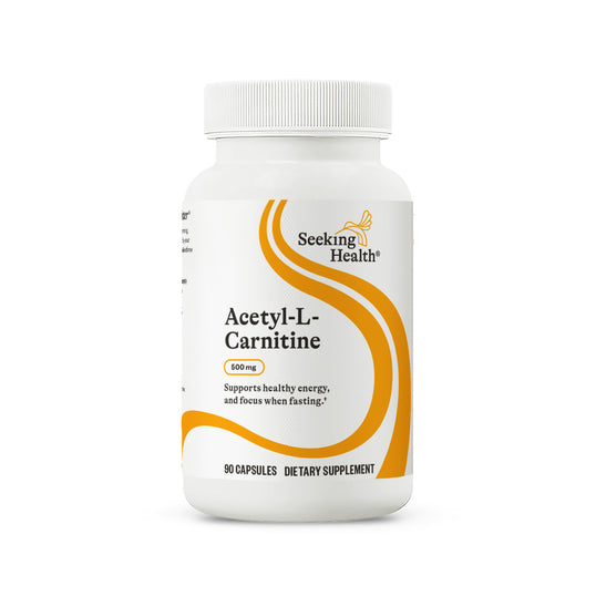 Supplement bottle labeled 'Acetyl-L-Carnitine' by Seeking Health on a white background