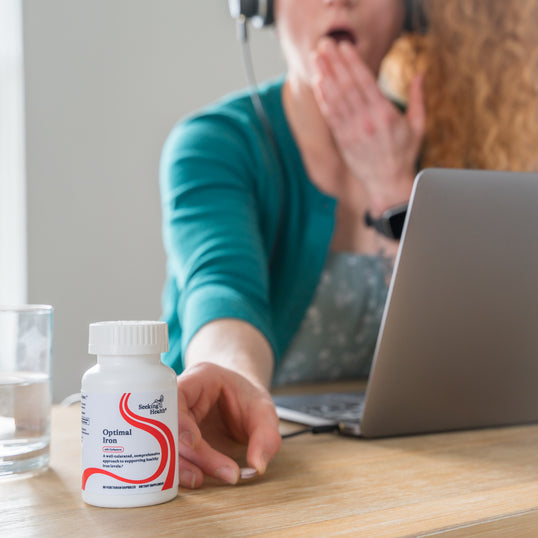 image of woman tired working at desk 