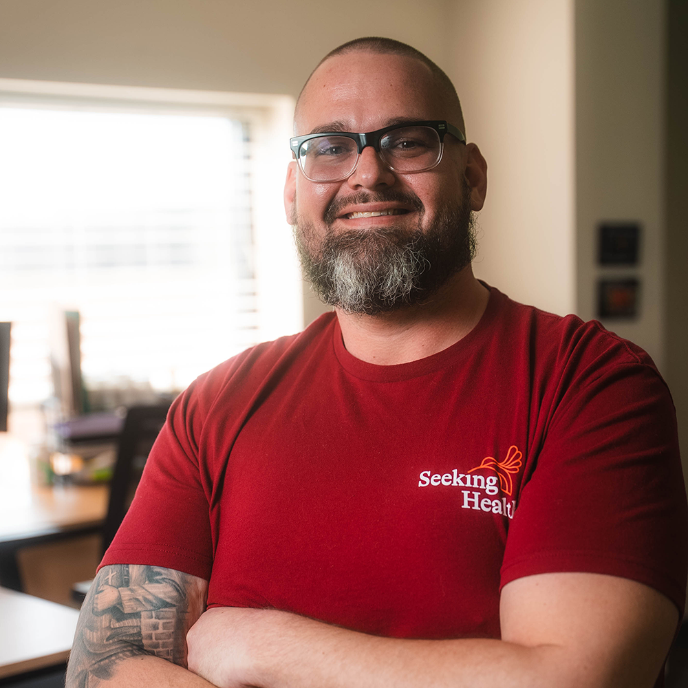 Person wearing a red seeking health shirt in office setting
