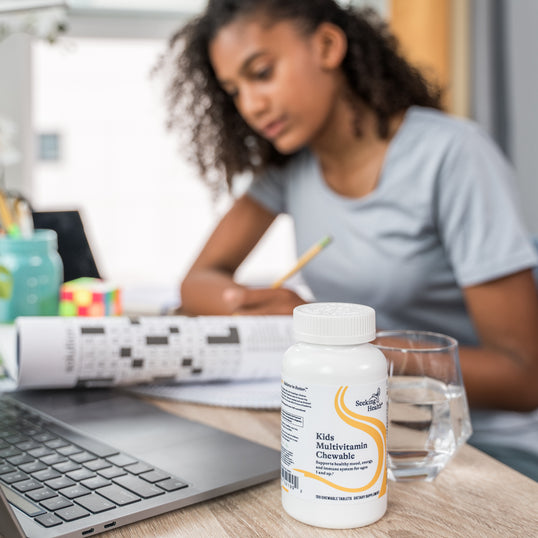 Image of young girl studying at desk 