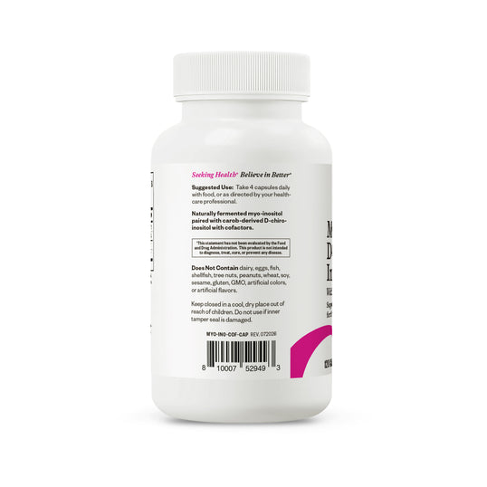 A white plastic bottle of Seeking Health Believes in Better supplement shown from the back, featuring a white label with black text, a barcode, and a magenta logo accent on a white background.