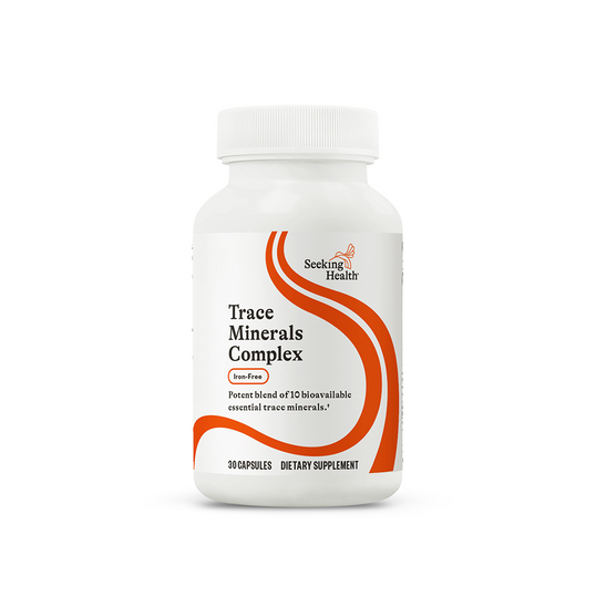 Supplement bottle labeled 'Trace Minerals Complex' by Seeking Health on a white background